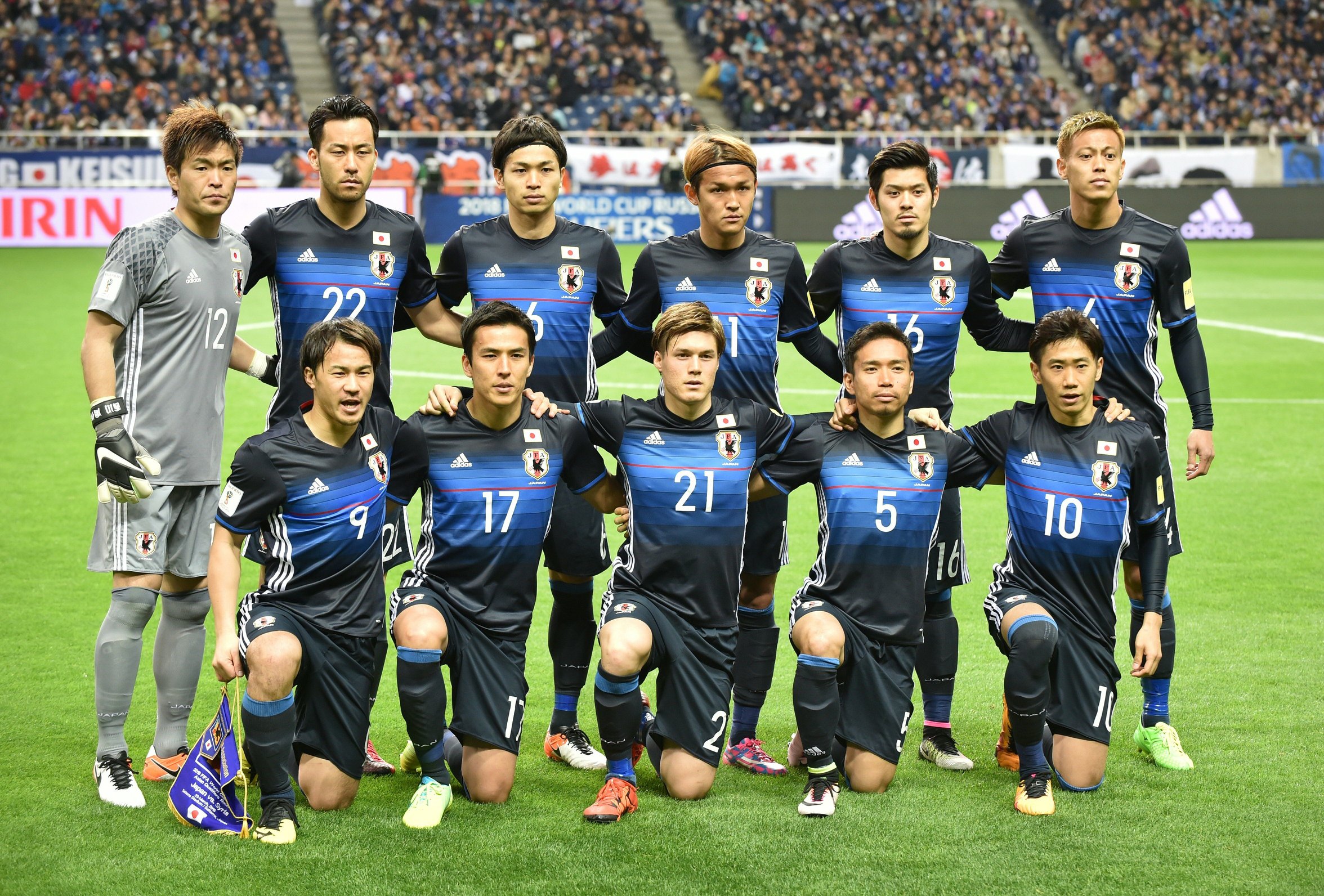 Starting players of Japan pose during a photo session prior to their 2018 World Cup qualifier Asian second-round Group E football match between Japan and Syria in Saitama. (JIJI PRESS/AFP/Getty Images)