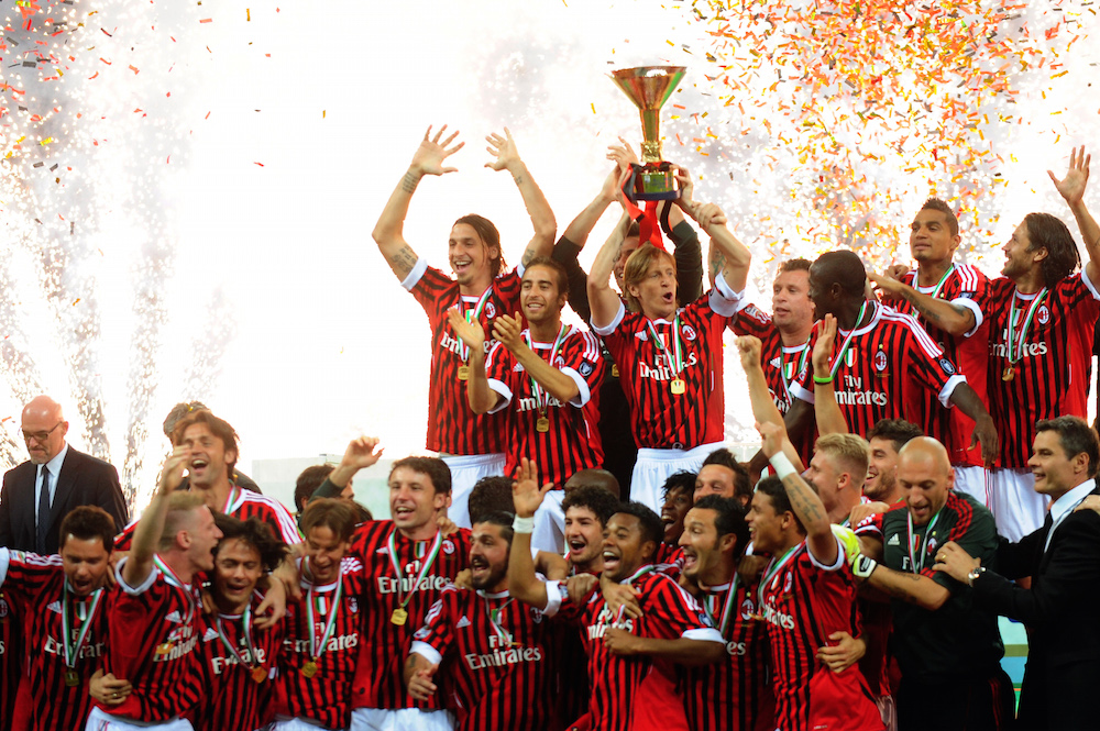 AC Milan players hold the Scudetto troph