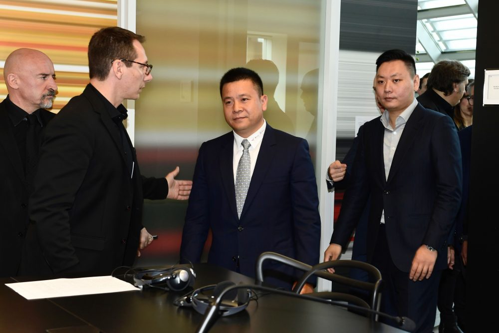 Head of Rossoneri Sport Investment Lux, Chinese businessman and new owner of the AC Milan football club, Yonghong Li (C) and Rossoneri Sport Investment Lux representative David Han Li (R) arrive for a press conference on April 14, 2017 in Milan. Serie A giants AC Milan were sold to Rossoneri Sport Investment Lux yesterday in a deal which sees the Chinese-led consortium take a 99.9% stake in the club. The seven-time European champions who are Italy's most succcessful club in international competition, have been owned by former three-time Italy prime minister Silvio Berlusconi since 1986. A joint statement by AC Milan's holding company Fininvest and Rossoneri Sport Investment Lux said on April 13, 2017 : "Today Fininvest has completed the sale of the entire stake owned in AC Milan - equal to 99.93% - to Rossoneri Sport Investment Lux." / AFP PHOTO / MIGUEL MEDINA (Photo credit should read MIGUEL MEDINA/AFP/Getty Images)