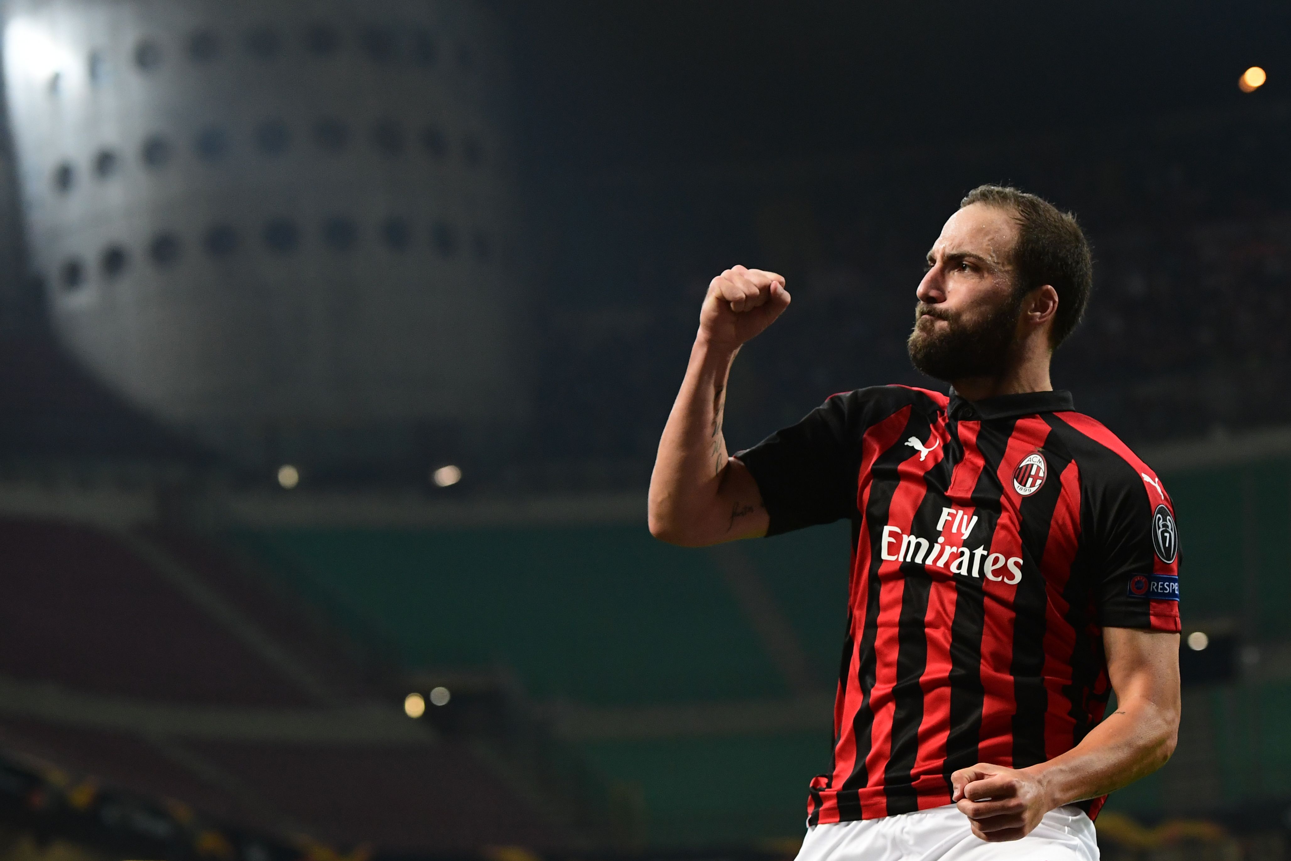 AC Milan's Argentine forward Gonzalo Higuain celebrates after scoring during the Europa League Group F football match between AC Milan and Olympiakos at the San Siro stadium on October 4, 2018 in Milan. (Photo by Miguel MEDINA / AFP) (Photo credit should read MIGUEL MEDINA/AFP/Getty Images)