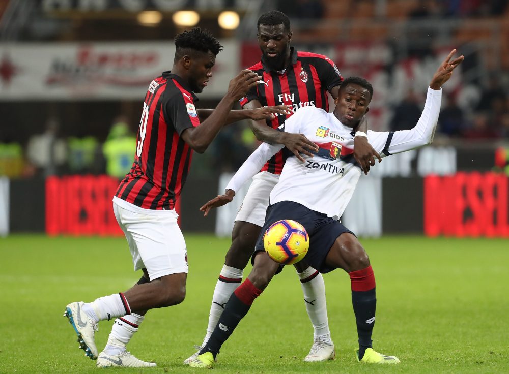 MILAN, ITALY - OCTOBER 31: Christian Kouame of Genoa CFC competes for the ball with Tiemoue Bakayoko and Franck Kessie (L) of AC Milan during the serie A match between AC Milan and Genoa CFC at Stadio Giuseppe Meazza on October 31, 2018 in Milan, Italy. (Photo by Marco Luzzani/Getty Images)