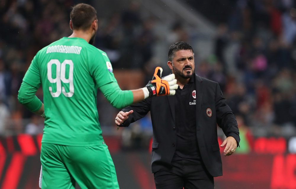 MILAN, ITALY - AUGUST 31: AC Milan coach Gennaro Gattuso (R) celebrates victory with Gianluigi Donnarumma (L) at the end of the serie A match between AC Milan and AS Roma at Stadio Giuseppe Meazza on August 31, 2018 in Milan, Italy. (Photo by Marco Luzzani/Getty Images)