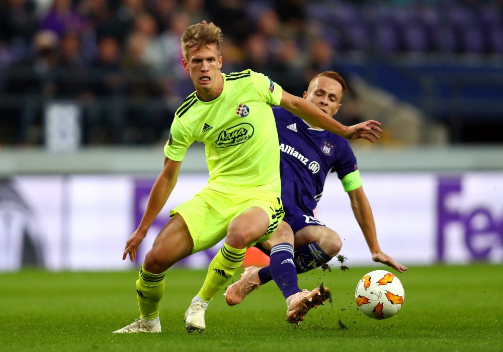 BRUSSELS, BELGIUM - OCTOBER 04: Adrien Trebel of RSC Anderlecht tackles Dani Olmo of Dinamo Zagreb during the UEFA Europa League Group D match between RSC Anderlecht and Dinamo Zagreb at Constant Vanden Stock Stadium on October 4, 2018 in Brussels, Belgium. (Photo by Dean Mouhtaropoulos/Getty Images)