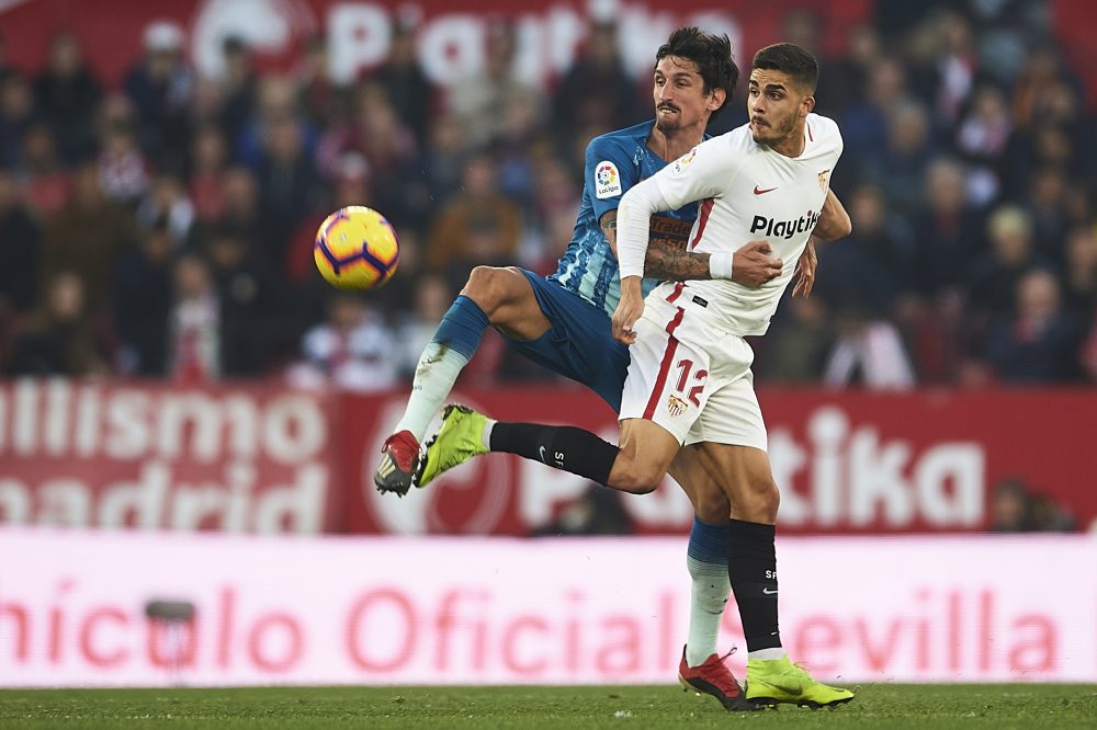 SEVILLE, SPAIN - JANUARY 06: Stefan Savic of Club Atletico de Madrid (L) competes for the ball with Andre Silva of Sevilla FC (R) during the La Liga match between Sevilla FC and Club Atletico de Madrid at Estadio Ramon Sanchez Pizjuan on January 06, 2019 in Seville, Spain. (Photo by Aitor Alcalde/Getty Images)