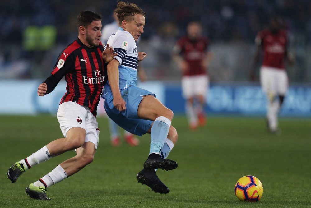 ROME, ITALY - FEBRUARY 26: Lucas Leiva of SS Lazio competes for the ball with Davide Calabria of AC Milan during the Coppa Italia match between SS Lazio and AC Milan on February 26, 2019 in Rome, Italy. (Photo by Paolo Bruno/Getty Images)