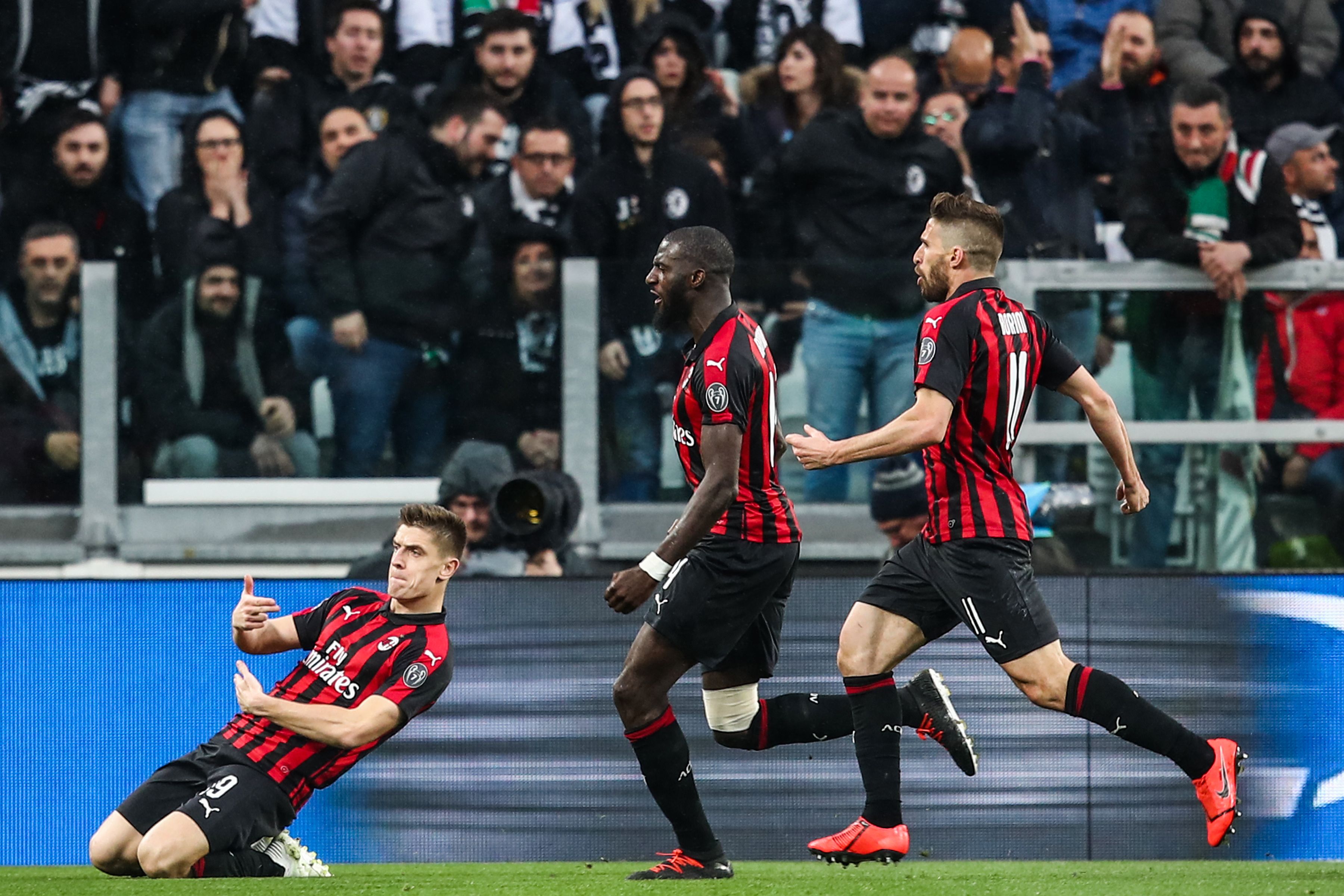 AC Milan's Polish forward Krzysztof Piatek (L) celebrates after opening the scoring during the Italian Serie A football match Juventus vs AC Milan on April 6, 2019 at the Juventus stadium in Turin. (Photo by Isabella BONOTTO / AFP) (Photo credit should read ISABELLA BONOTTO/AFP/Getty Images)