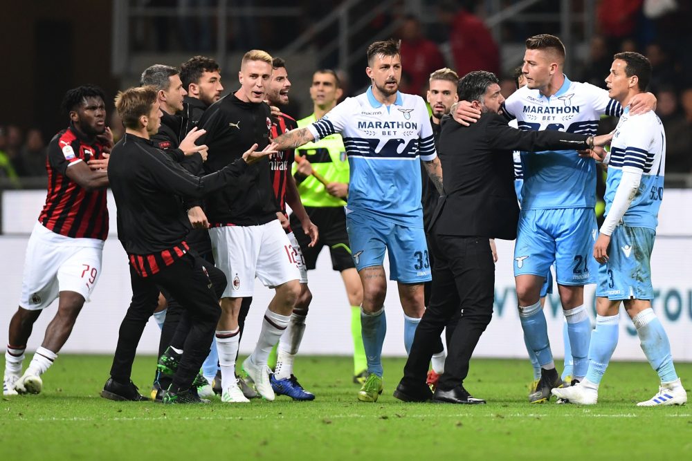 AC Milan's Italian coach Gennaro Gattuso (3rdR) and Lazio's Serbian midfielder Sergej Milinkovic-Savic (2ndR) intervene to put an end to a scuffle between Lazio's Brazilian defender Luiz Felipe (R) and AC Milan's Ivorian midfielder Franck Kessie (Far L) at the end of the Italian Serie A football match AC Milan vs Lazio Rome on April 13, 2019 at the San Siro stadium in Milan. (Photo by Miguel MEDINA / AFP) (Photo credit should read MIGUEL MEDINA/AFP/Getty Images)