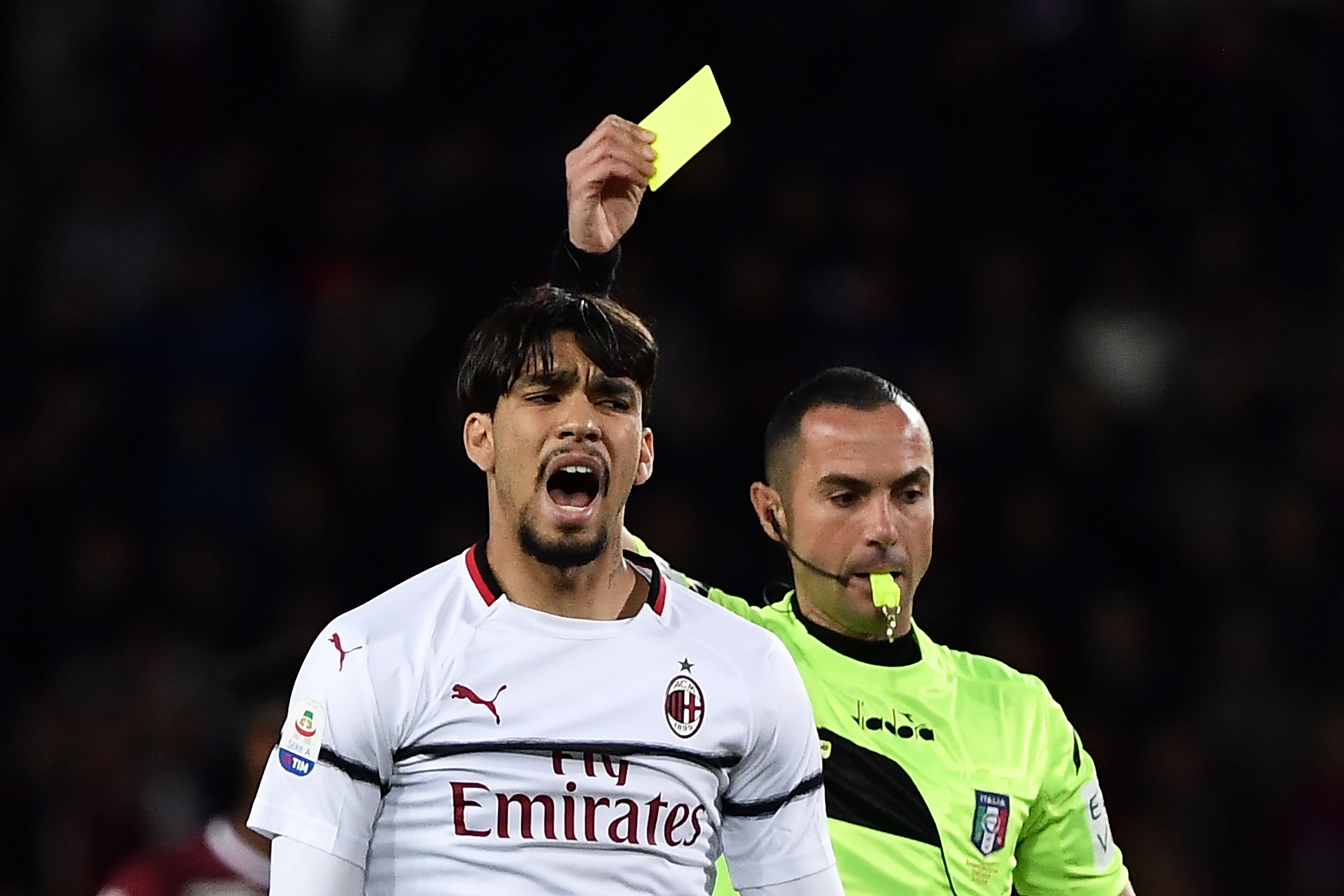 Referee Marco Guida gives a yellow card to AC Milan's Brazilian midfielder Lucas Paqueta during the Italian Serie A football match between Torino and AC Milan on April 28, 2019 at the Grande Torino stadium in Turin. (Photo by MARCO BERTORELLO / AFP)        (Photo credit should read MARCO BERTORELLO/AFP/Getty Images)