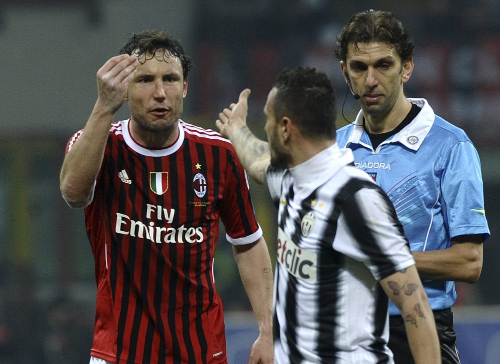 MILAN, ITALY - FEBRUARY 25: Mark Van Bommel (L) of Milan reacts with Simone Pepe (C) of Juventus during the Serie A match between AC Milan and Juventus FC at Stadio Giuseppe Meazza on February 25, 2012 in Milan, Italy. (Photo by Dino Panato/Getty Images)