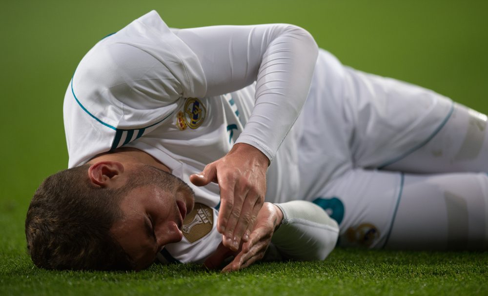 MADRID, SPAIN - MARCH 03: Theo Hernandez of Real Madrid reacts after taking a knock during the La Liga match between Real Madrid and Getafe at Estadio Santiago Bernabeu on March 3, 2018 in Madrid, Spain. (Photo by Denis Doyle/Getty Images)