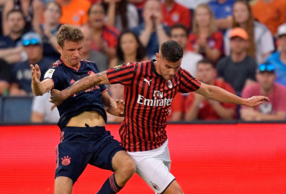 Bayern Munich's Thomas Muller (L) fights for the ball with Milan's Theo Hernandez during their International Champions Cup football match between Fc Bayern and AC Milan at Children's Mercy Park in Kansas City, Kansas on July 23, 2019. (Photo by Tim VIZER / AFP) (Photo credit should read TIM VIZER/AFP/Getty Images)