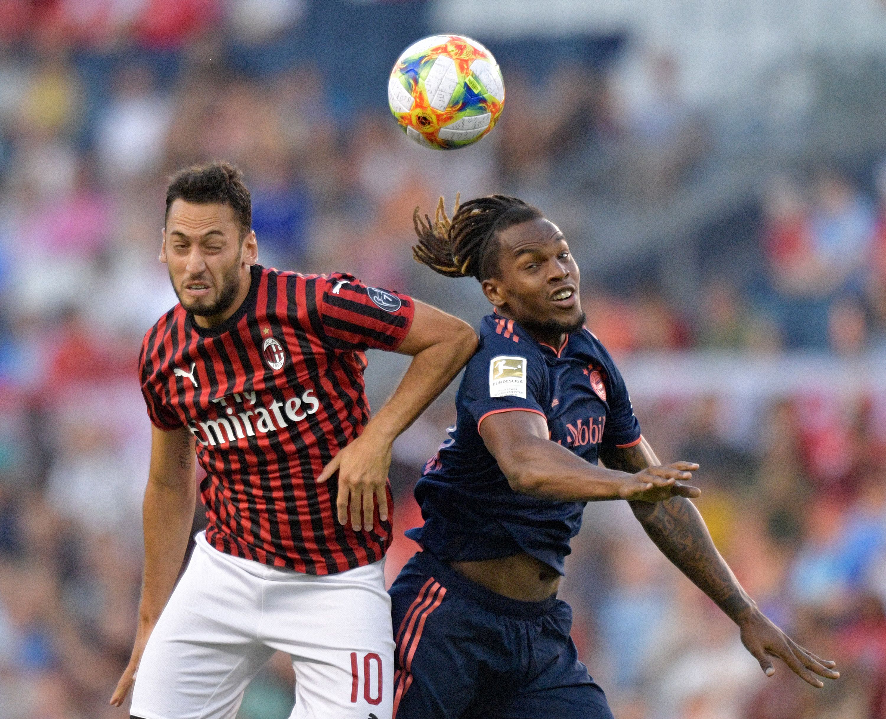 Milan's Hakan Calhanoglu (L) and Bayern Munich's Renato Sanches leap for a header during the International Champions Cup football match between Fc Bayern and AC Milan at Children's Mercy Park in Kansas City, Missouri on July 23, 2019. (Photo by Tim VIZER / AFP) (Photo credit should read TIM VIZER/AFP/Getty Images)