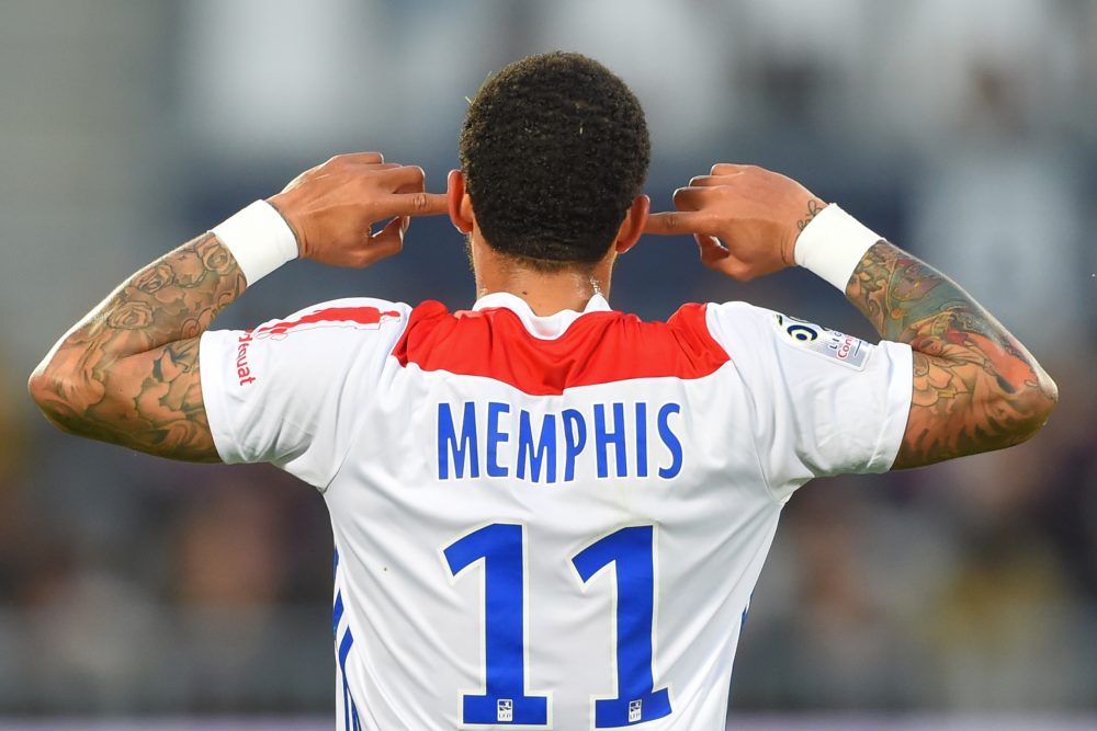 TOPSHOT - Lyon's Dutch forward Memphis Depay celebrates after scoring a goal during the French L1 football match between Bordeaux (FCGB) and Lyon (OL) on April 26, 2019 at the Matmut Atlantique stadium in Bordeaux, southwestern France. (Photo by NICOLAS TUCAT / AFP) (Photo credit should read NICOLAS TUCAT/AFP/Getty Images)