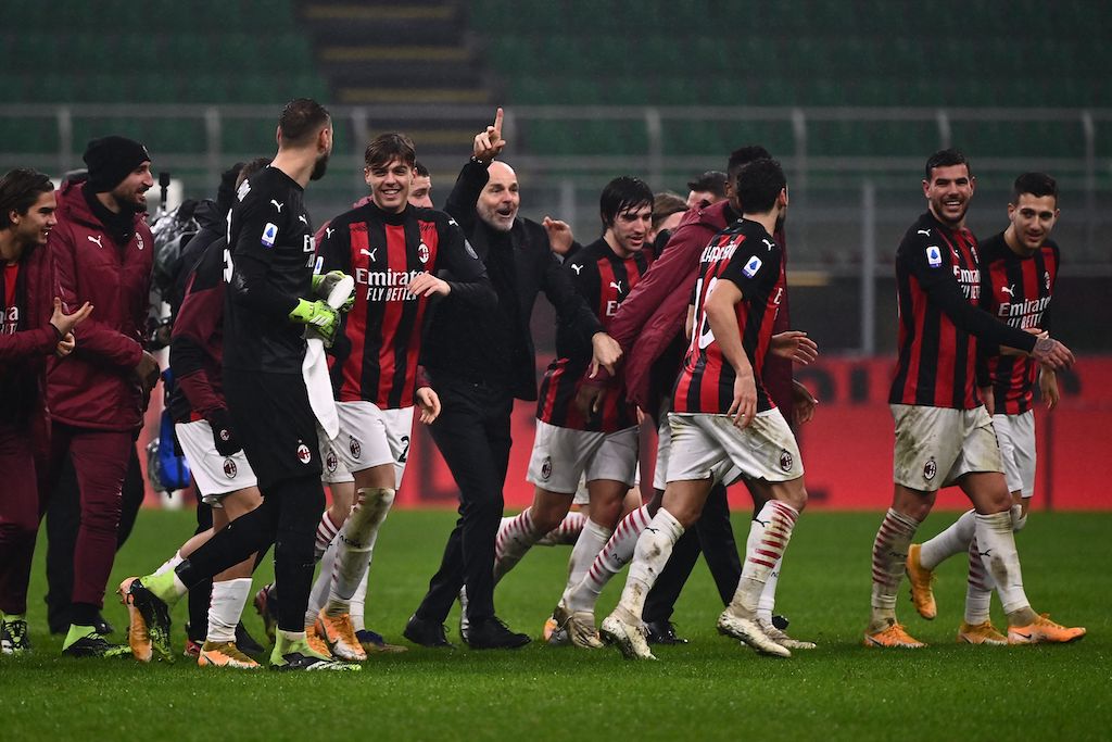 AC Milan's Italian coach Stefano Pioli (C), AC Milan's Italian forward Daniel Maldini (C-L), AC Milan's French defender Theo Hernandez (2ndR) and teammates celebrate at the end of the Italian Serie A football match AC Milan vs Lazio Rome on December 23, 2020 at the San Siro stadium in Milan. (Photo by Marco BERTORELLO / AFP) (Photo by MARCO BERTORELLO/AFP via Getty Images)AC Milan's Italian coach Stefano Pioli (C), AC Milan's Italian forward Daniel Maldini (C-L), AC Milan's French defender Theo Hernandez (2ndR) and teammates celebrate at the end of the Italian Serie A football match AC Milan vs Lazio Rome on December 23, 2020 at the San Siro stadium in Milan. (Photo by Marco BERTORELLO / AFP) (Photo by MARCO BERTORELLO/AFP via Getty Images)