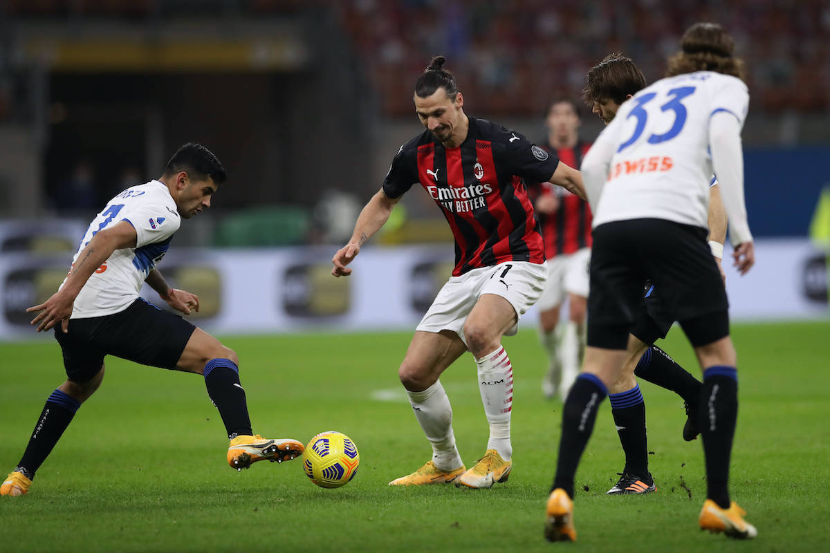 Cristian Romero of Atalanta dispossesses Zlatan Ibrahimovic of AC Milan during the Serie A match at Giuseppe Meazza, Milan. Picture date: 23rd January 2021. Picture credit should read: Jonathan Moscrop/Sportimage PUBLICATIONxNOTxINxUK SPI-0857-0019