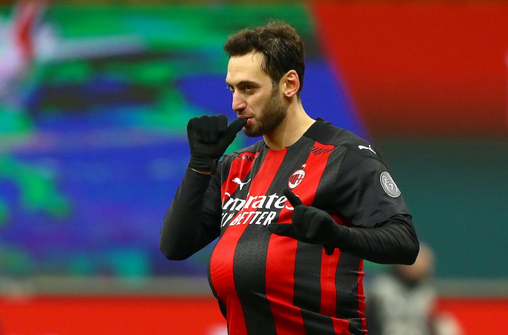 MILAN, ITALY - JANUARY 12: Hakan Calhanoglu of A.C. Milan celebrates after scoring the winning penalty during a penalty shoot out during the Coppa Italia match between AC Milan and Torino FC at Stadio Giuseppe Meazza on January 12, 2021 in Milan, Italy. Sporting stadiums around Italy remain under strict restrictions due to the Coronavirus Pandemic as Government social distancing laws prohibit fans inside venues resulting in games being played behind closed doors. (Photo by Marco Luzzani/Getty Images)