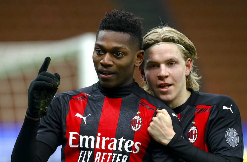MILAN, ITALY - JANUARY 09: Rafael Leao of Milan celebrates with teammate Jens Petter Hauge after scoring their sides first goal during the Serie A match between AC Milan and Torino FC at Stadio Giuseppe Meazza on January 09, 2021 in Milan, Italy. Sporting stadiums around Italy remain under strict restrictions due to the Coronavirus Pandemic as Government social distancing laws prohibit fans inside venues resulting in games being played behind closed doors. (Photo by Marco Luzzani/Getty Images)