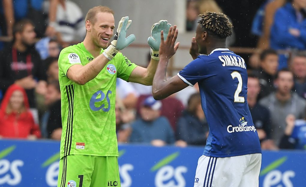 Strasbourg's Belgian goalkeeper Matz Sels (L) and Strasbourg's French defender Mohamed Simakan celebrate at the end of the French L1 football match between Strasbourg (RCSA) and Montpellier (MHSC) on September 29, 2019 at the Meinau stadium in Strasbourg, eastern France. (Photo by PATRICK HERTZOG / AFP) (Photo credit should read PATRICK HERTZOG/AFP via Getty Images)