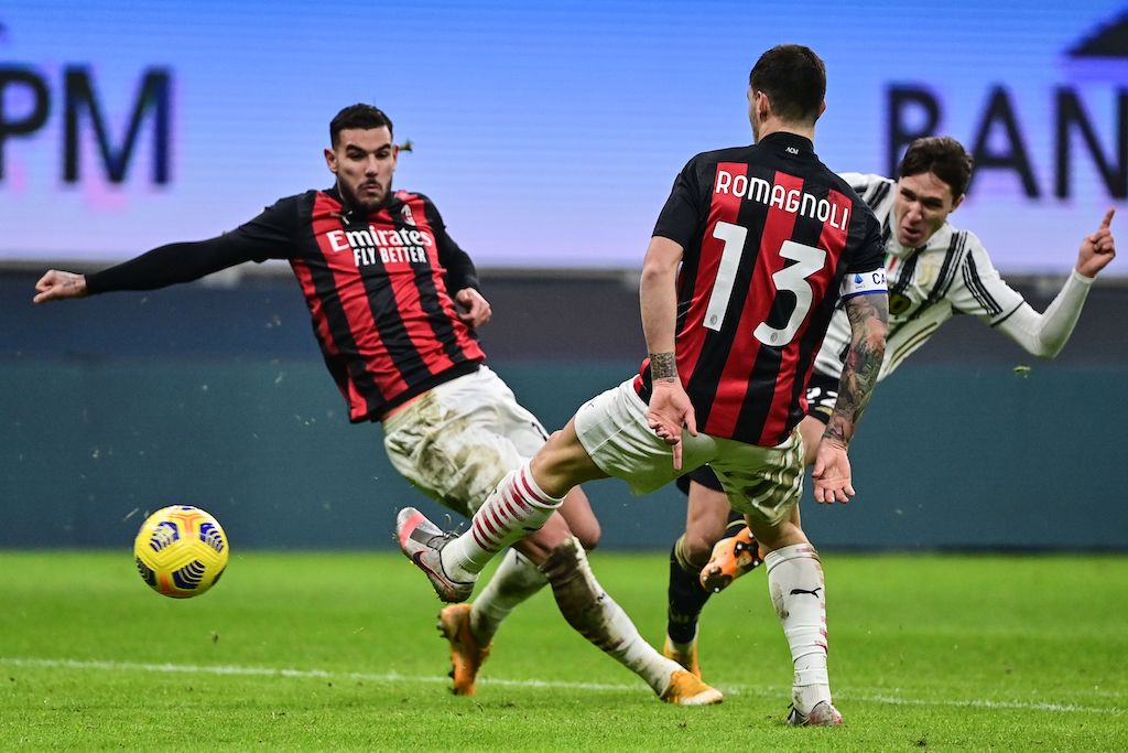 Juventus' Italian forward Federico Chiesa (Rear R) shoots to score his second goal during the Italian Serie A football match AC Milan vs Juventus on January 6, 2021 at the San Siro stadium in Milan. (Photo by MIGUEL MEDINA / AFP) (Photo by MIGUEL MEDINA/AFP via Getty Images)