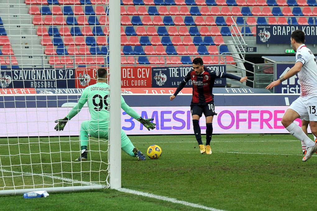BOLOGNA, ITALY - JANUARY 30: Gianluigi Donnarumma goalkeeper of AC Milan saves his goal during the Serie A match between Bologna FC and AC Milan at Stadio Renato Dall'Ara on January 30, 2021 in Bologna, Italy. (Photo by Mario Carlini / Iguana Press/Getty Images)