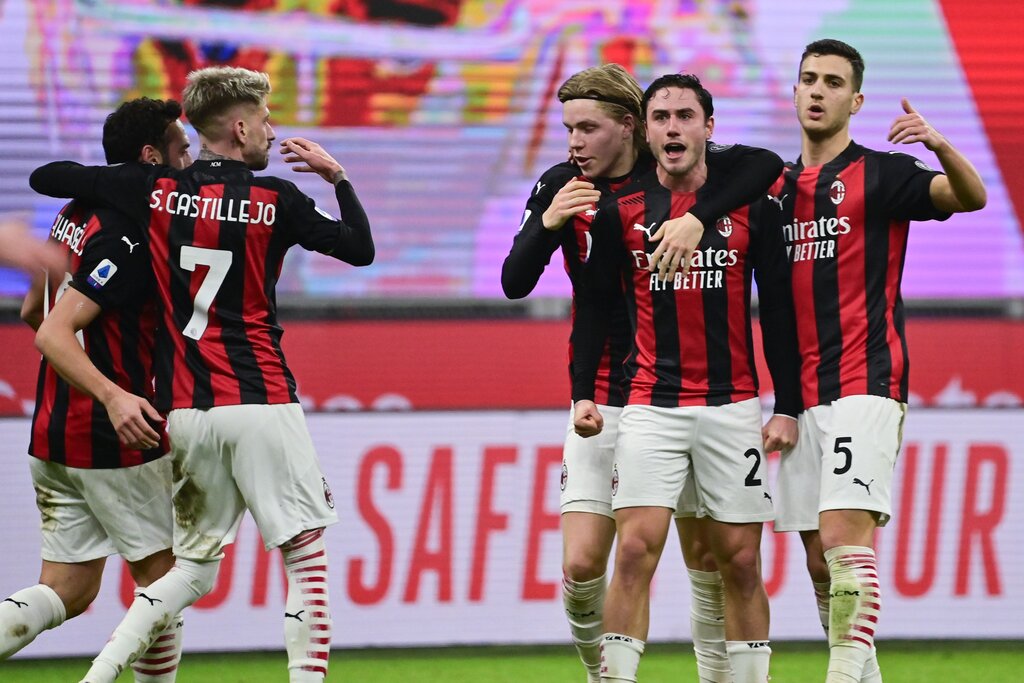 AC Milan's Italian defender Davide Calabria (2ndR) celebrates with teammates after scoring an equalizer during the Italian Serie A football match AC Milan vs Juventus on January 6, 2021 at the San Siro stadium in Milan. (Photo by MIGUEL MEDINA / AFP) (Photo by MIGUEL MEDINA/AFP via Getty Images)