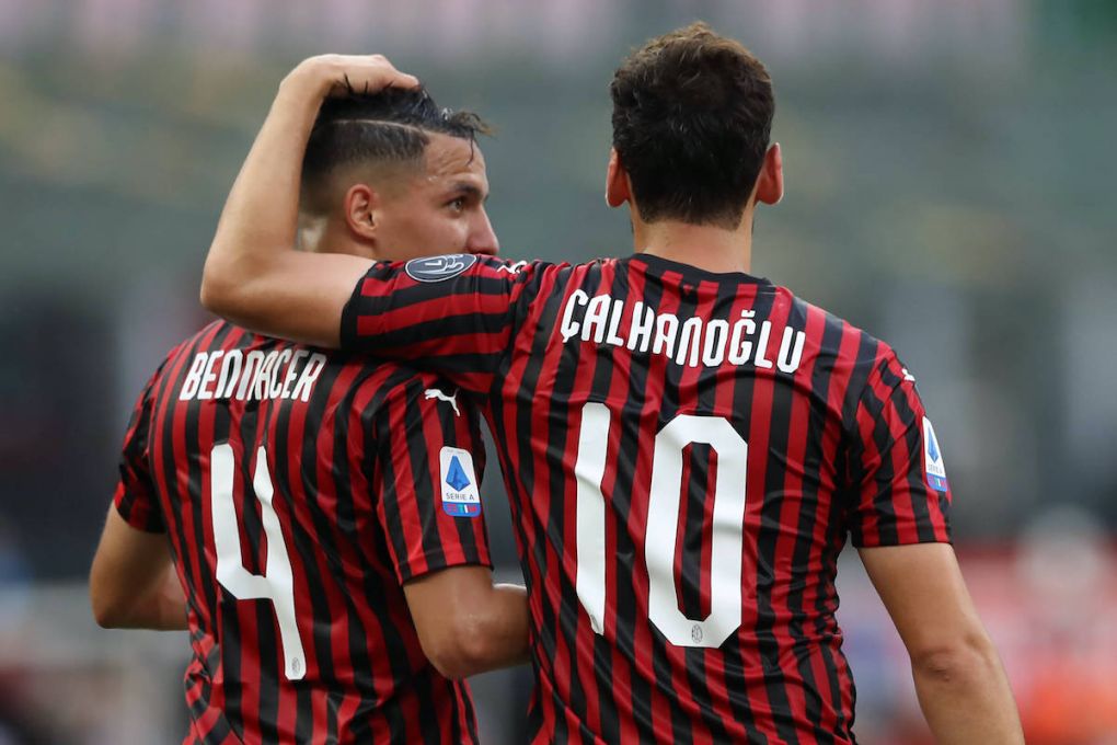AC Milan s Turkish midfielder Hakan Calhanoglua celebrates with Algerian midfielder Ismael Bennacer after scoring form the penalty mark to give the side a 2-0 lead during the Serie A match at Giuseppe Meazza, Milan. Picture date: 28th June 2020. Picture credit should read: Jonathan Moscrop/Sportimage PUBLICATIONxNOTxINxUK SPI-0569-0045