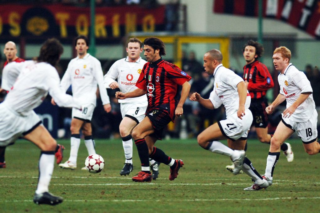 MILAN, ITALY - MARCH 08: Rui Costa of AC Milan controls the ball under pressure of Manchester United defense during the UEFA Champions League Round of 16 second leg match between AC Milan and Manchester United at the Stadio Giuseppe Meazza on March 8, 2005 in Milan, Italy. (Photo by Etsuo Hara/Getty Images)