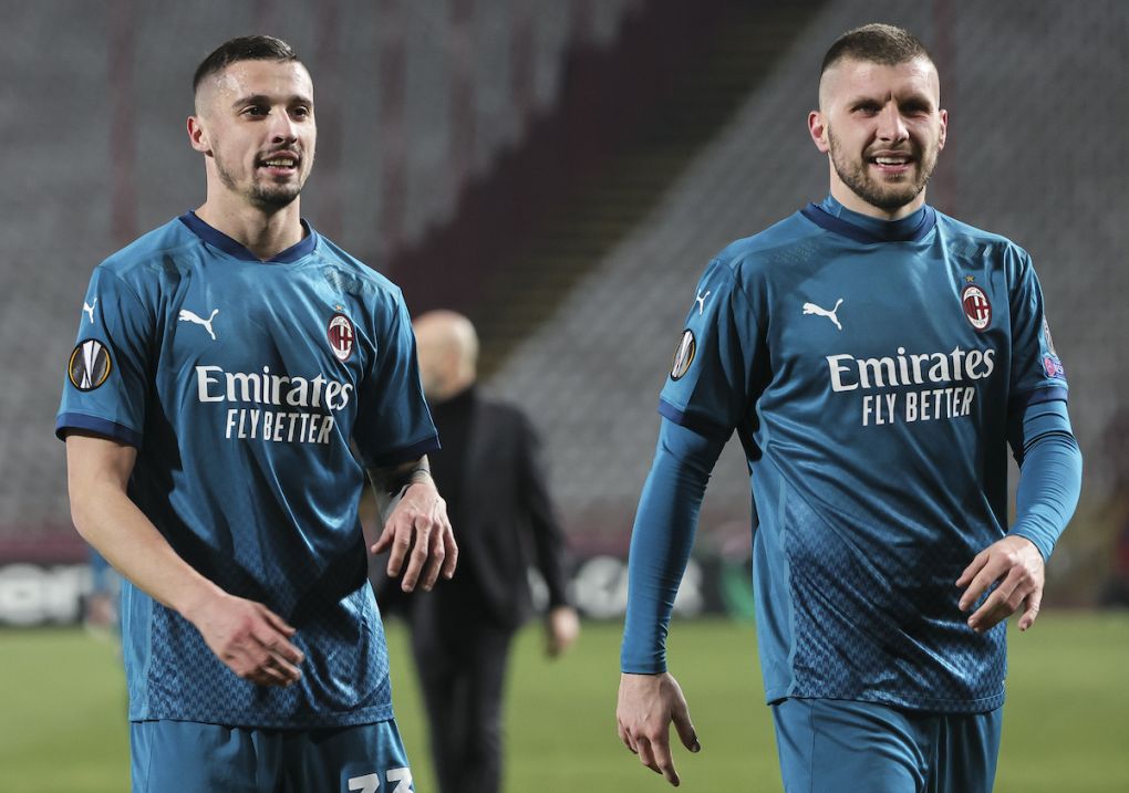 BELGRADE, SERBIA - FEBRUARY 18: Rade Krunic (L) and Ante Rebic (R) of AC Milan smile during the UEFA Europa League Round of 32 match between Crvena Zvezda and AC Milan at on February 17, 2021 in Belgrade, Serbia. (Photo by Srdjan Stevanovic/Getty Images)