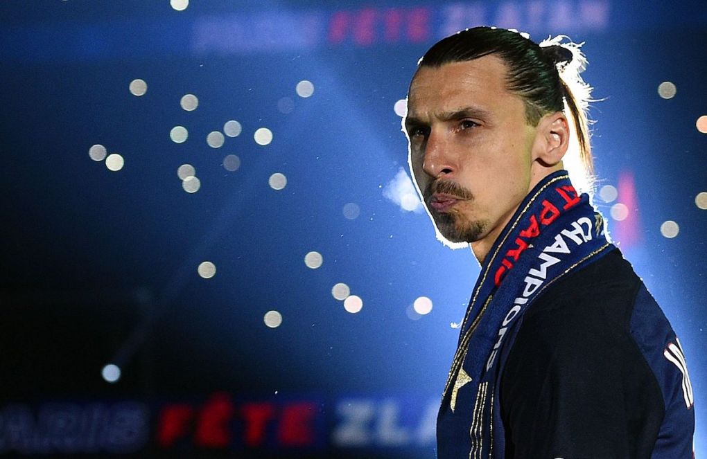 Paris Saint-Germain's Swedish forward Zlatan Ibrahimovic reacts on the podium after winning the French L1 title at the end of the French L1 football match Paris Saint-Germain (PSG) vs Nantes on May 14, 2016 at the Parc des Princes stadium in Paris. A / AFP / FRANCK FIFE (Photo credit should read FRANCK FIFE/AFP via Getty Images)