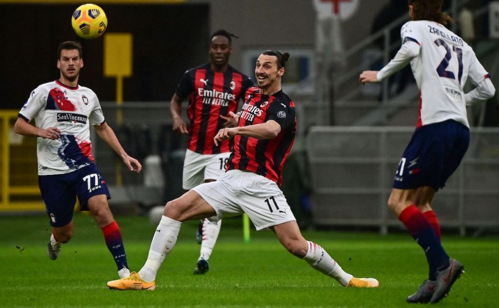 AC Milan's Swedish forward Zlatan Ibrahimovic (C) and Crotone's Serbian midfielder Milos Vulic (L) go for the ball during the Italian Serie A football match AC Milan vs Crotone on February 7, 2021 at the San Siro stadium in Milan. (Photo by MIGUEL MEDINA / AFP) (Photo by MIGUEL MEDINA/AFP via Getty Images)