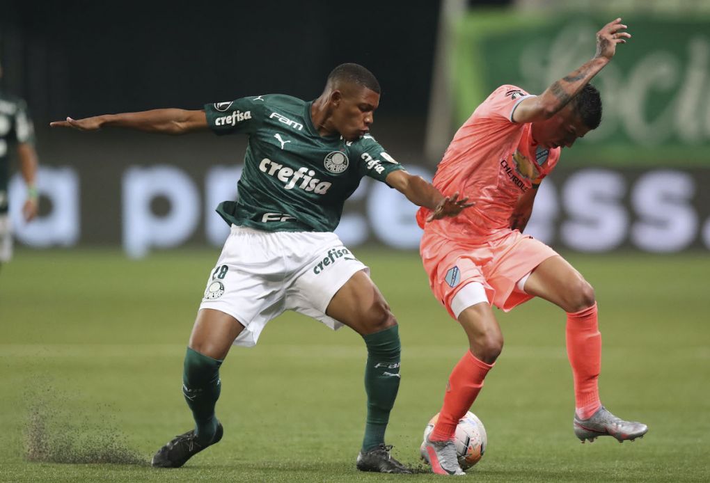 Brazil's Palmeiras midfielder Danilo (L) and Bolivia's Bolivar defender Juan Carlos Arce vie for the ball during their closed-door Copa Libertadores group phase football match at the Arena Allianz stadium in Sao Paulo, Brazil, on September 30, 2020, amid the COVID-19 novel coronavirus pandemic. (Photo by AMANDA PEROBELLI / POOL / AFP) (Photo by AMANDA PEROBELLI/POOL/AFP via Getty Images)
