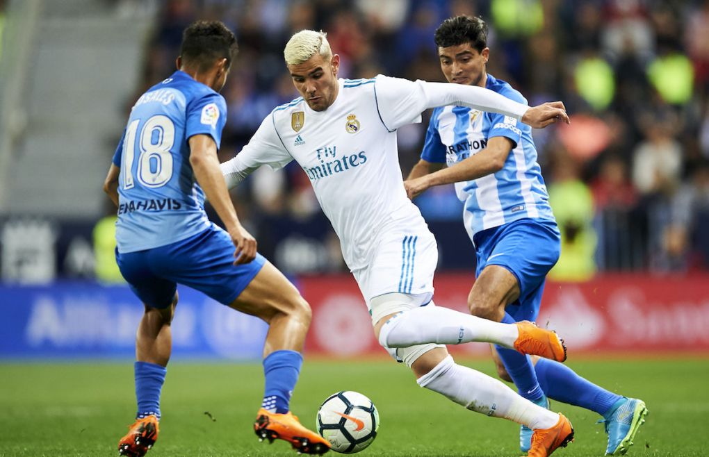 MALAGA, SPAIN - APRIL 15: France Theo Hernandez of Real Madrid competes for the ball with Chory Castro of Malaga during the La Liga match between Malaga CF and Real Madrid CF at Estadio La Rosaleda on April 15, 2018 in Malaga, Spain. (Photo by Aitor Alcalde/Getty Images)