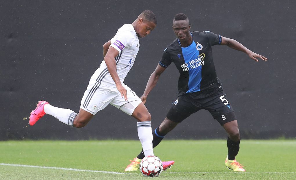 OHL's Yannick Aguemon and Club's Odilon Kossounou fight for the ball during a friendly game between first league team Club Brugge and 1B team OH Leuven, Saturday 04 July 2020 in Westkapelle, in preparation of the upcoming 2020-2021 Jupiler Pro League season. BELGA PHOTO BRUNO FAHY (Photo by BRUNO FAHY/BELGA MAG/AFP via Getty Images)