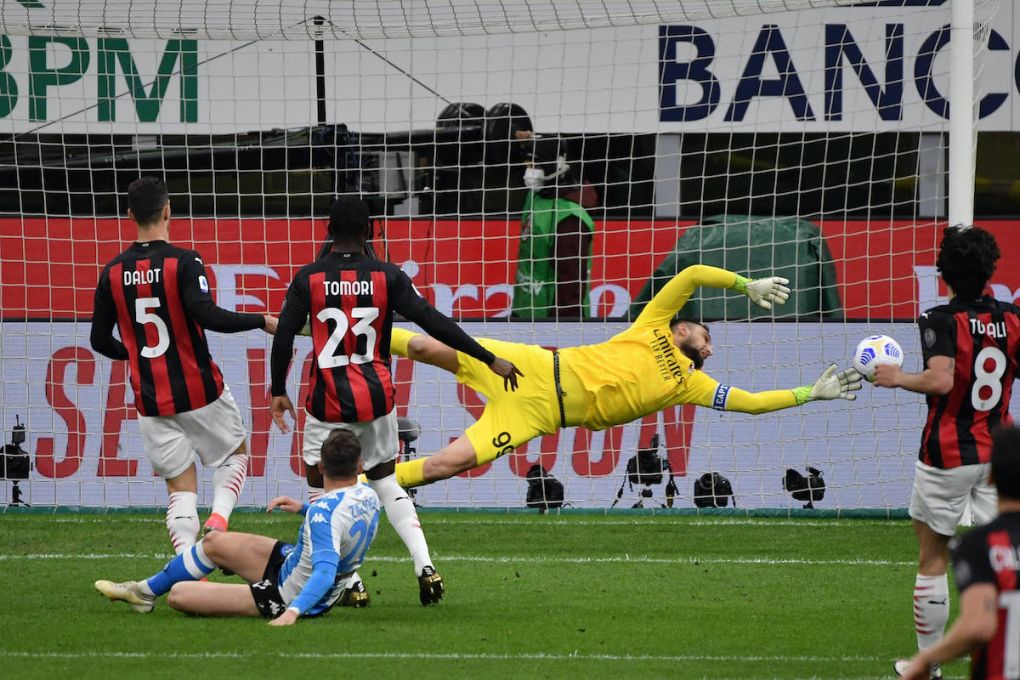 Gianluigi Donnarumma of AC Milan saves on Piotr Zielinski of SSC Napoli during the Serie A football match between AC Milan and SSC Napoli at San Siro Stadium in Milano Italy, March 14th, 2021. Photo Andrea Staccioli / Insidefoto andreaxstaccioli