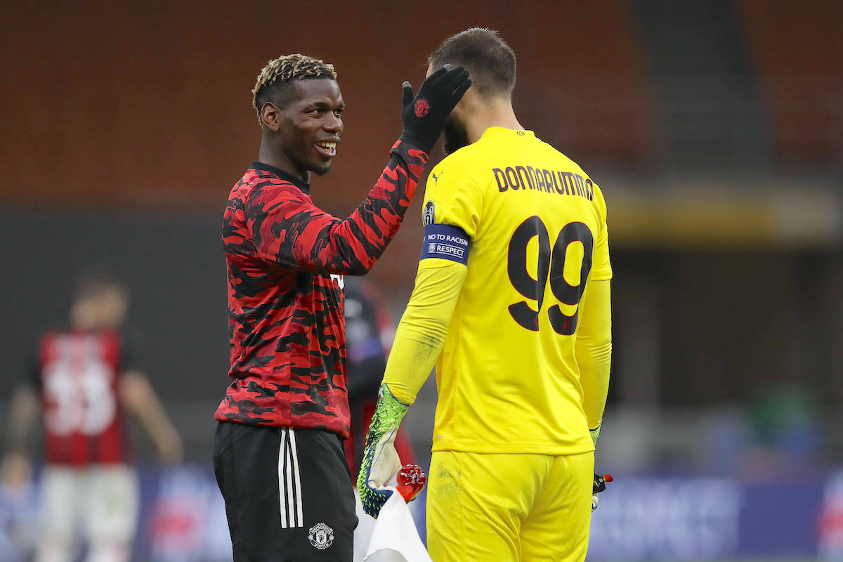 Paul Pogba of Manchester United, ManU salutes Gianluigi Donnarumma of AC Milan during the half time interval of the UEFA Europa League match at Giuseppe Meazza, Milan. Picture date: 18th March 2021. Picture credit should read: Jonathan Moscrop/Sportimage PUBLICATIONxNOTxINxUK SPI-0961-0124