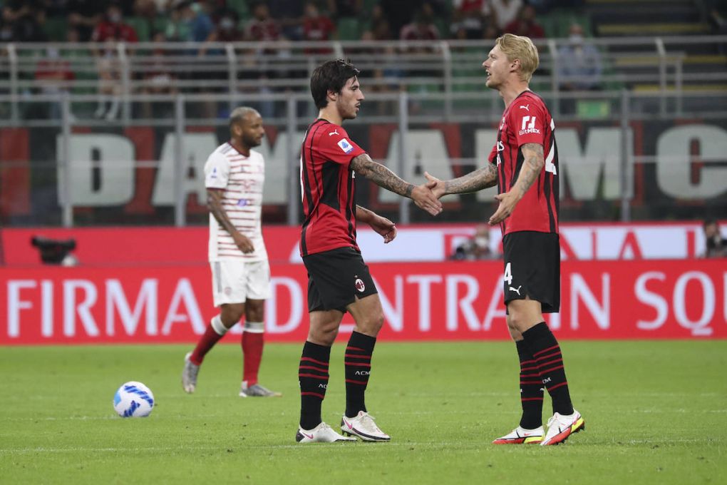 Sandro Tonali L of AC Milan celebrates with Simon Kjaer