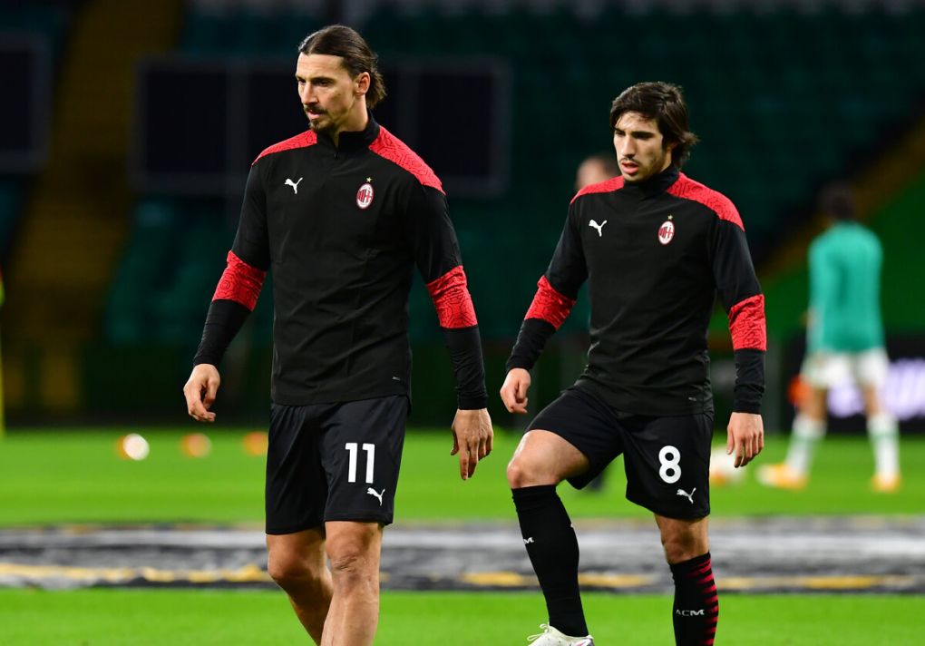 GLASGOW, SCOTLAND - OCTOBER 22: Zlatan Ibrahimovic looks on with team mate Sandro Tonali during the warm up ahead of the UEFA Europa League Group H stage match between Celtic and AC Milan at Celtic Park on October 22, 2020 in Glasgow, Scotland. Sporting stadiums around the UK remain under strict restrictions due to the Coronavirus Pandemic as Government social distancing laws prohibit fans inside venues resulting in games being played behind closed doors. (Photo by Mark Runnacles/Getty Images)