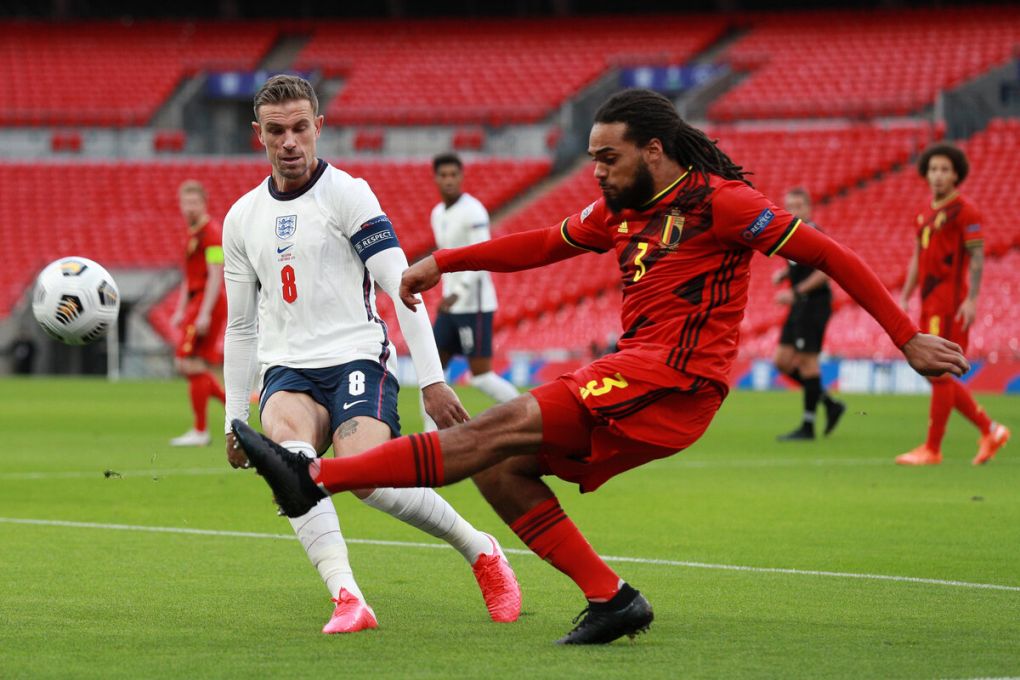 LONDON, ENGLAND - OCTOBER 11: Jason Denayer of Belgium shoots past Jordan Henderson of England during the UEFA Nations League group stage match between England and Belgium at Wembley Stadium on October 11, 2020 in London, England. Football Stadiums around Europe remain empty due to the Coronavirus Pandemic as Government social distancing laws prohibit fans inside venues resulting in fixtures being played behind closed doors. (Photo by Ian Walton - Pool/Getty Images)