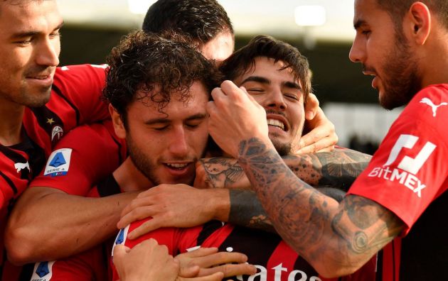 AC Milan's Spanish midfielder Brahim Diaz (2ndR) celebrates with (From L) AC Milan's Italian defender Alessio Romagnoli, AC Milan's Italian defender Davide Calabria and AC Milan's French defender Theo Hernandez (R) after scoring during the Italian Serie A football match between Spezia and AC Milan on September 25, 2021 at the Alberto-Picco stadium in La Spezia. (Photo by Alberto PIZZOLI / AFP) (Photo by ALBERTO PIZZOLI/AFP via Getty Images)