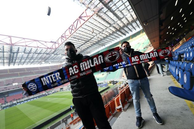 MILAN, ITALY - FEBRUARY 05: Fans show their support with scarves prior to the Serie A match between FC Internazionale and AC Milan at Stadio Giuseppe Meazza on February 05, 2022 in Milan, Italy. (Photo by Marco Luzzani/Getty Images)