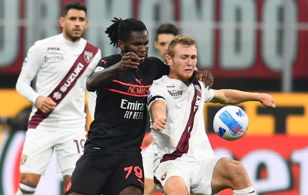 Franck Kessie of AC Milan competes for the ball with Tommaso Pobega of Torino FC