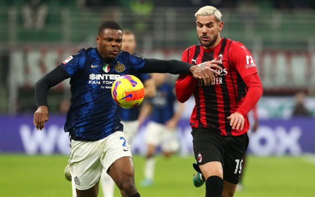Denzel Dumfries of FC Internazionale is challenged by Theo Hernandez of AC Milan