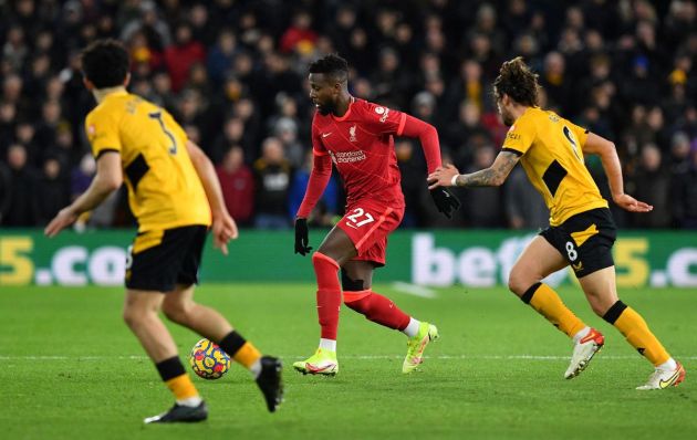 Liverpool's Belgium striker Divock Origi (C) controls the ball during the English Premier League football match between Wolverhampton Wanderers and Liverpool at the Molineux stadium in Wolverhampton, central England on December 4, 2021. - RESTRICTED TO EDITORIAL USE. No use with unauthorized audio, video, data, fixture lists, club/league logos or 'live' services. Online in-match use limited to 120 images. An additional 40 images may be used in extra time. No video emulation. Social media in-match use limited to 120 images. An additional 40 images may be used in extra time. No use in betting publications, games or single club/league/player publications. (Photo by JUSTIN TALLIS / AFP) / RESTRICTED TO EDITORIAL USE. No use with unauthorized audio, video, data, fixture lists, club/league logos or 'live' services. Online in-match use limited to 120 images. An additional 40 images may be used in extra time. No video emulation. Social media in-match use limited to 120 images. An additional 40 images may be used in extra time. No use in betting publications, games or single club/league/player publications. / RESTRICTED TO EDITORIAL USE. No use with unauthorized audio, video, data, fixture lists, club/league logos or 'live' services. Online in-match use limited to 120 images. An additional 40 images may be used in extra time. No video emulation. Social media in-match use limited to 120 images. An additional 40 images may be used in extra time. No use in betting publications, games or single club/league/player publications. (Photo by JUSTIN TALLIS/AFP via Getty Images)
