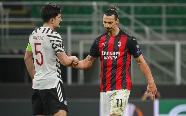 Manchester United's England's defender Harry Maguire (L) and AC Milan's Swedish forward Zlatan Ibrahimovic shake hands at the end of the UEFA Europa League round of 16 second leg football match between AC Milan and Manchester United at San Siro stadium in Milan on March 18, 2021. (Photo by Marco BERTORELLO / AFP) (Photo by MARCO BERTORELLO/AFP via Getty Images)