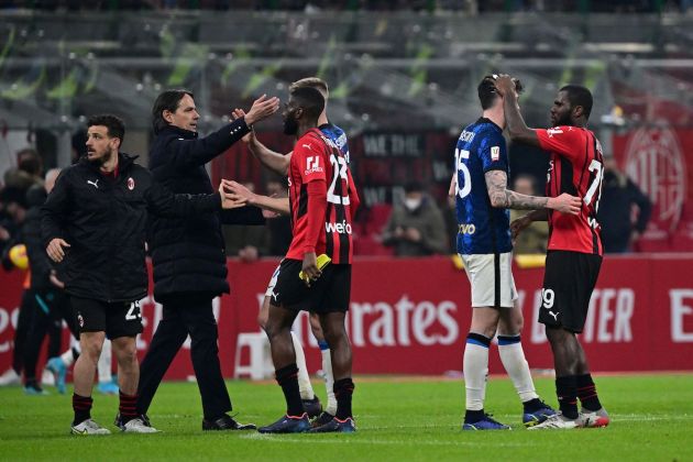 Inter Milan's Italian head coach Simone Inzaghi (2nd L) reacts with players after a draw in the Italian Cup semi-final first leg football match between AC Milan and Inter Milan at the Giuseppe Meazza Stadium in Milan on March 1, 2022. (Photo by MIGUEL MEDINA / AFP) (Photo by MIGUEL MEDINA/AFP via Getty Images)