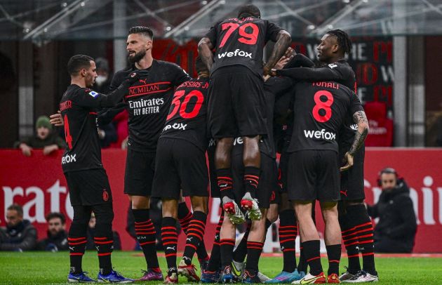 AC Milan's Algerian midfielder Ismael Bennacer (L), AC Milan's French forward Olivier Giroud (2ndL), AC Milan's Portuguese forward Rafael Leao (R) and teammates celebrate after AC Milan's French defender Pierre Kalulu (hidden) opened the scoring during the Italian Serie A football match between AC Milan and Empoli on March 12, 2022 at the San Siro stadium in Milan. (Photo by Miguel MEDINA / AFP) (Photo by MIGUEL MEDINA/AFP via Getty Images)