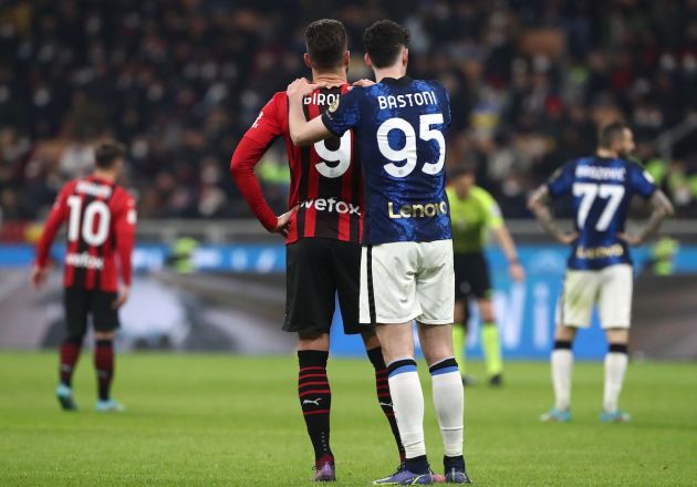 Alessandro Bastoni (R) of FC Internazionale embraces Olivier Giroud (L) of AC Milan