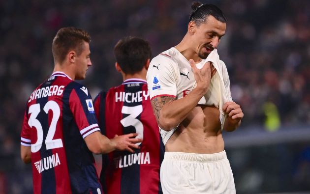 AC Milan's Swedish forward Zlatan Ibrahimovic (R) reacts next to Bologna's Swedish midfielder Mattias Svanberg