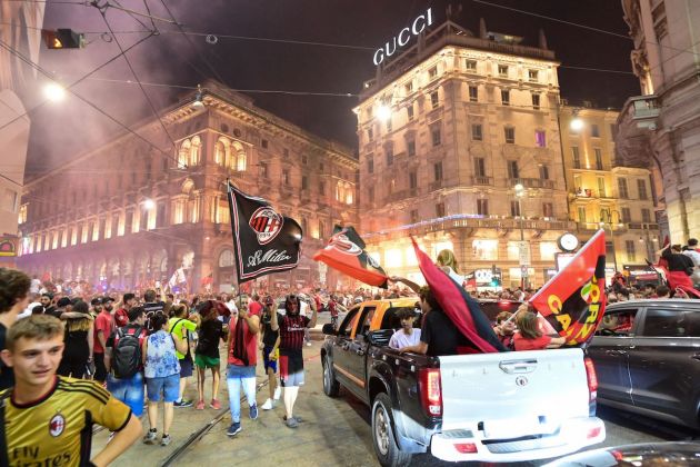 AC Milan fans celebrate in downtown Milan