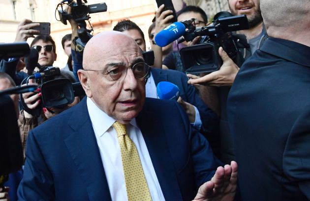 Adriano Galliani (C), CEO of Italian Serie A football club AC Milan, arrives at a notary's office where representatives of Fininvest, the Silvio Berlusconi's holding, and representatives of Chinese consortium Sino-Europe Sports (SES), are meeting today on April 13, 2017 in Milan. A new era in Italian football was hailed today after AC Milan were sold to Rossoneri Sport Investment Lux, formerly known as Sino-Europe Sports (SES), in a deal which sees the Chinese-led consortium take a 99.9 % stake in the club. Milan, the seven-time European champions who are Italy's most succcessful club at international level, have been owned since 1986 by Silvio Berlusconi, a former three-time Prime Minister of Italy. / AFP PHOTO / MIGUEL MEDINA (Photo credit should read MIGUEL MEDINA/AFP via Getty Images)